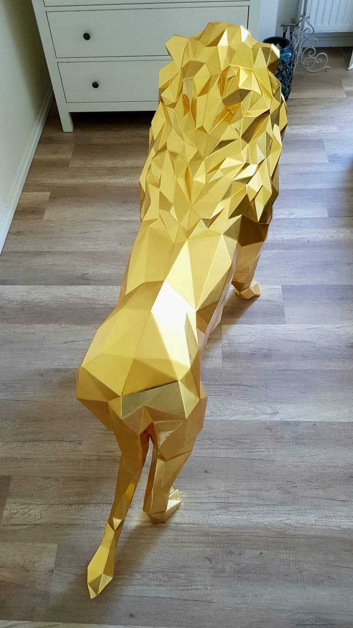 WILD Lion sculpture covered with 24 karat gold leaf and diamond eyes - METALUXURY