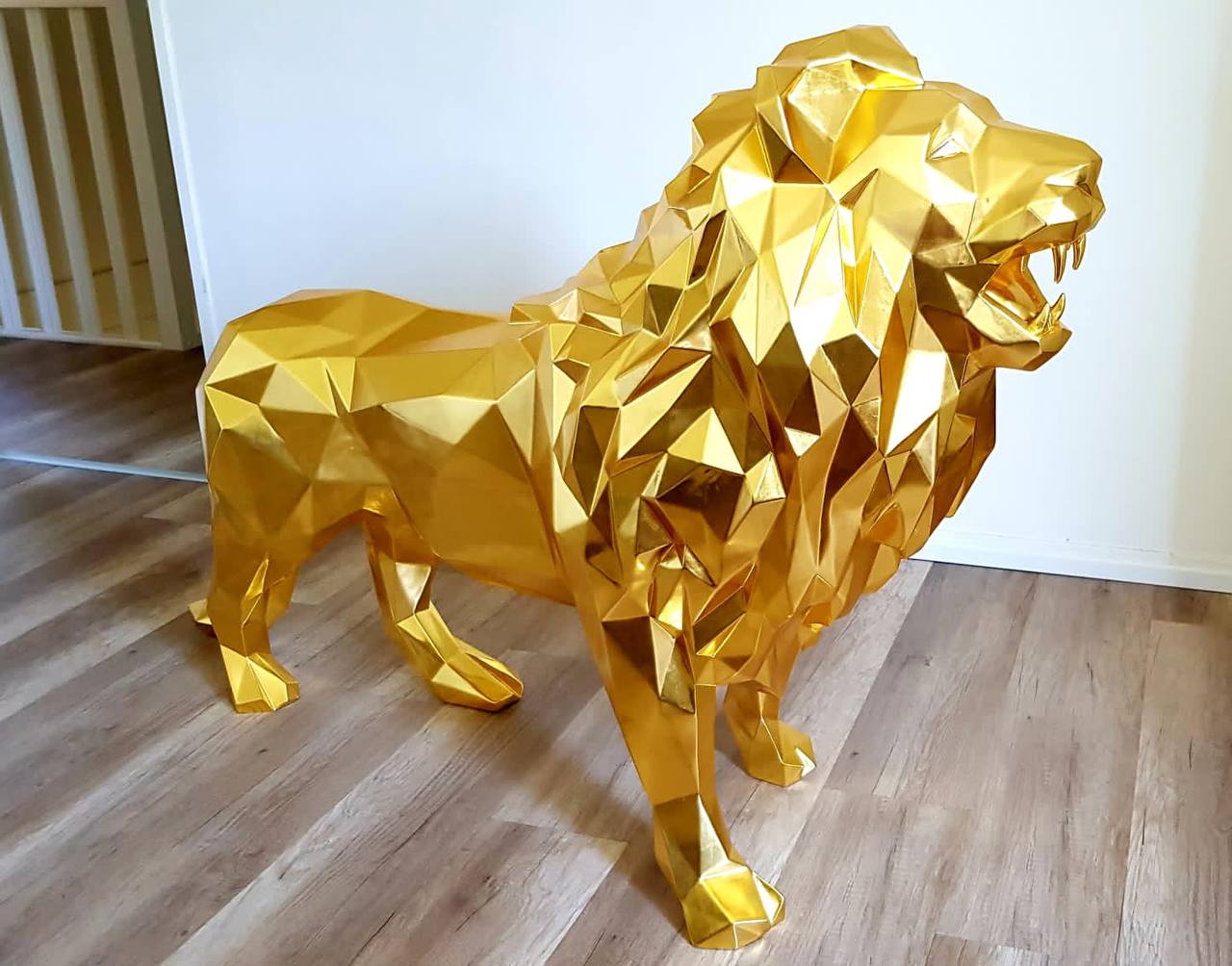 WILD Lion sculpture covered with 24 karat gold leaf and diamond eyes - METALUXURY