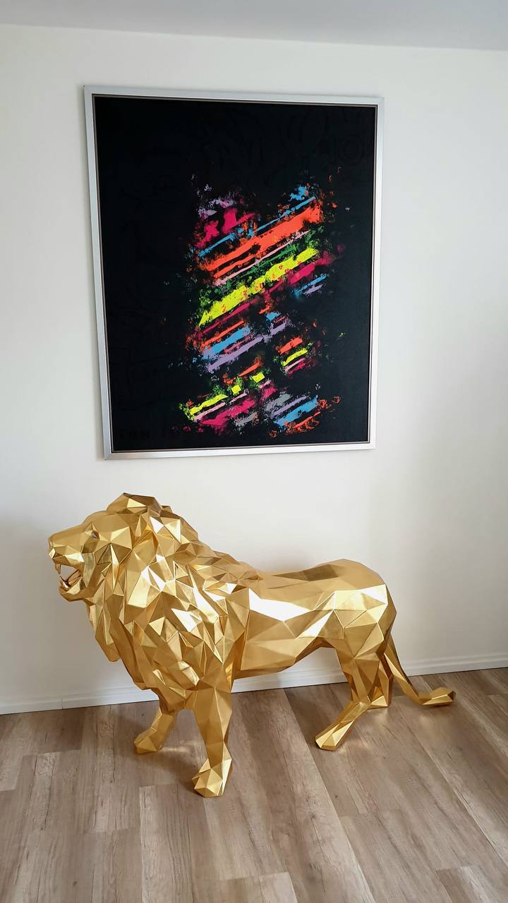 WILD Lion sculpture covered with 24 karat gold leaf and diamond eyes